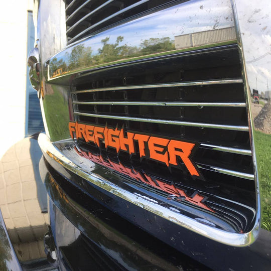 Firefighter Emblem Orange on Black mounted 3